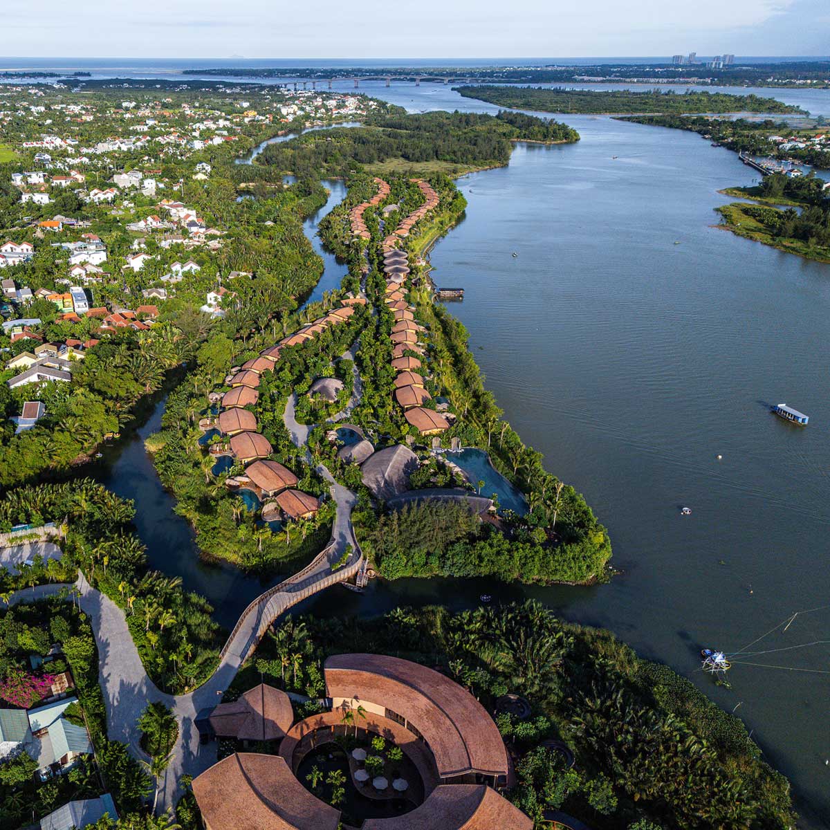 Stunning aerial view of Namia River Retreat, one of the best wellness resorts near Hoi An Ancient Town, Vietnam.
